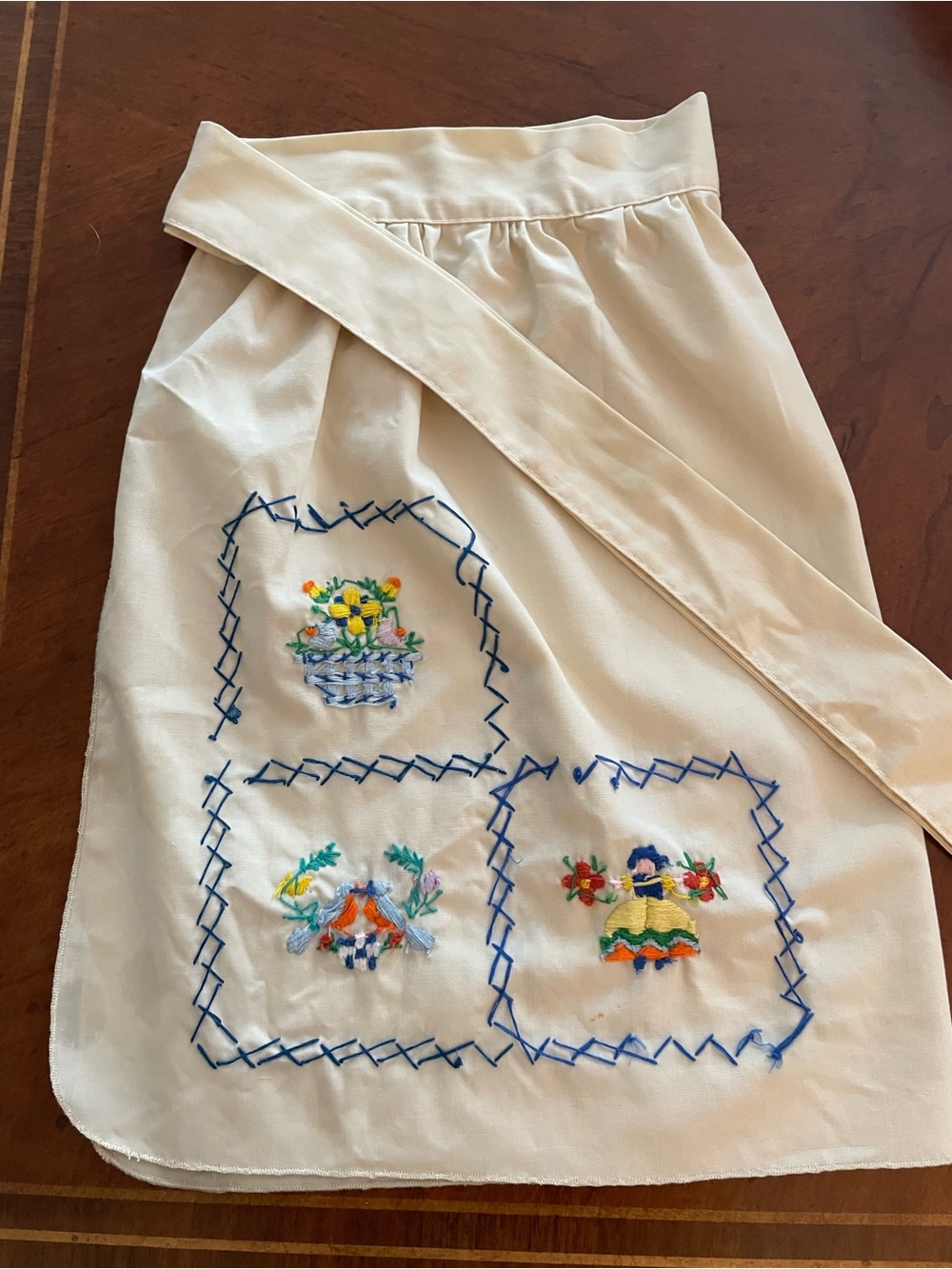 Cream Embroidered Apron with Blue-Trim Floral Panels